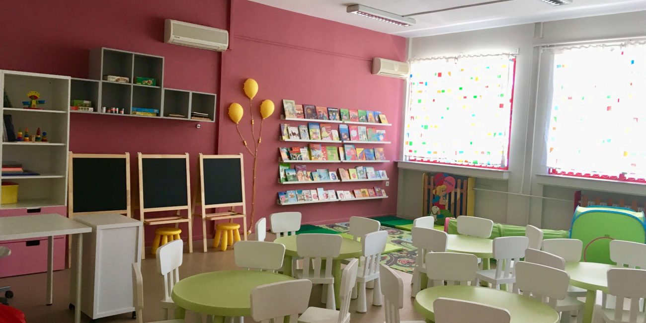 Kindergarten classroom with tables and chairs