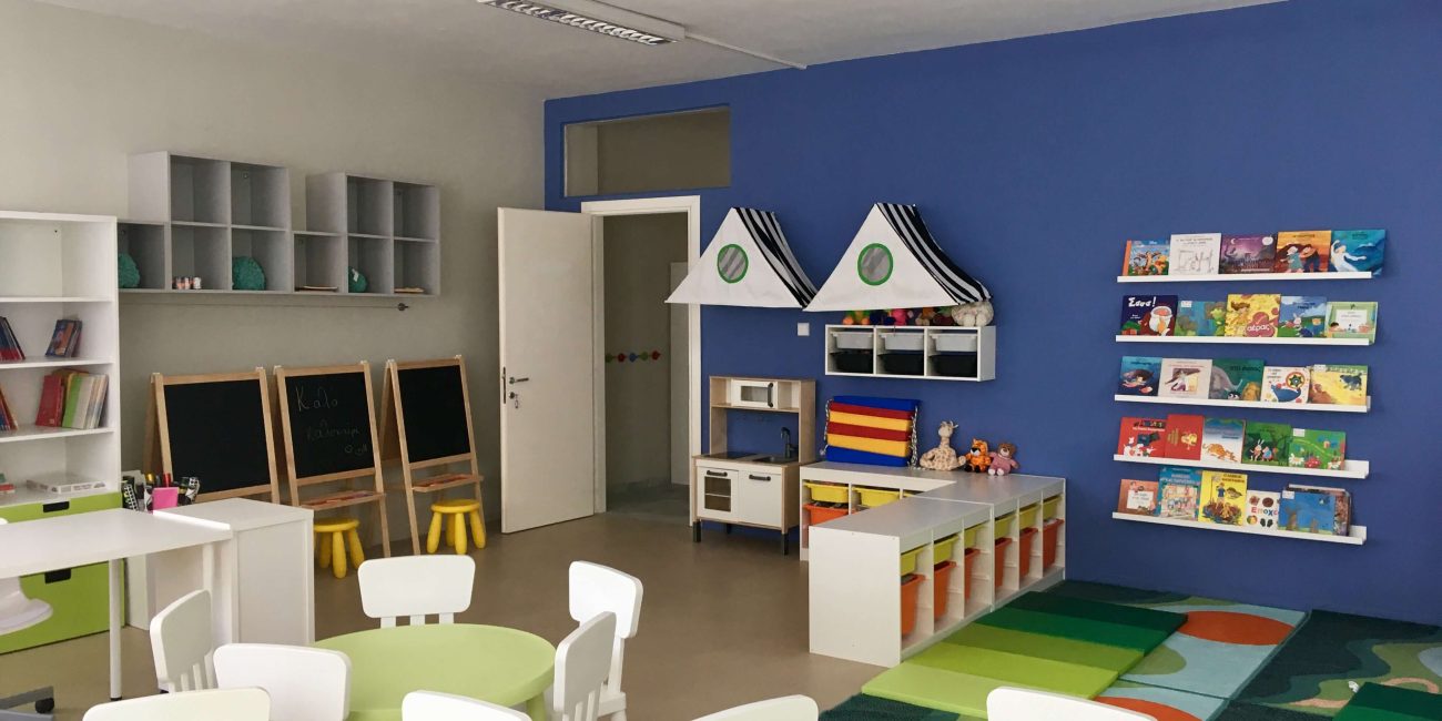Kindergarten classroom with tables and chairs
