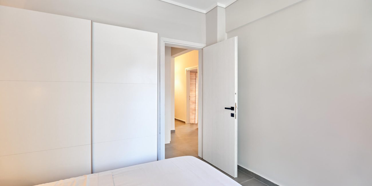 From bedroom looking through door onto corridor