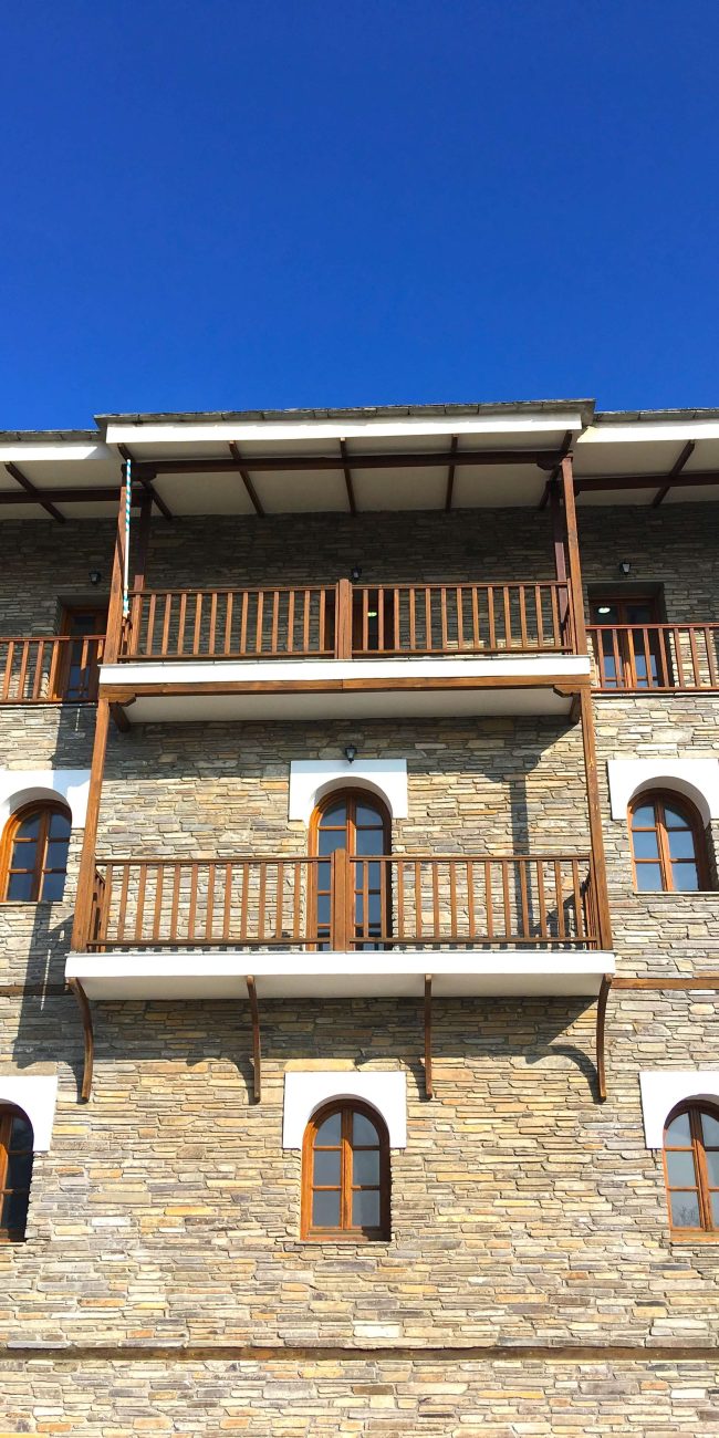 Face of 3 storey building and blue sky