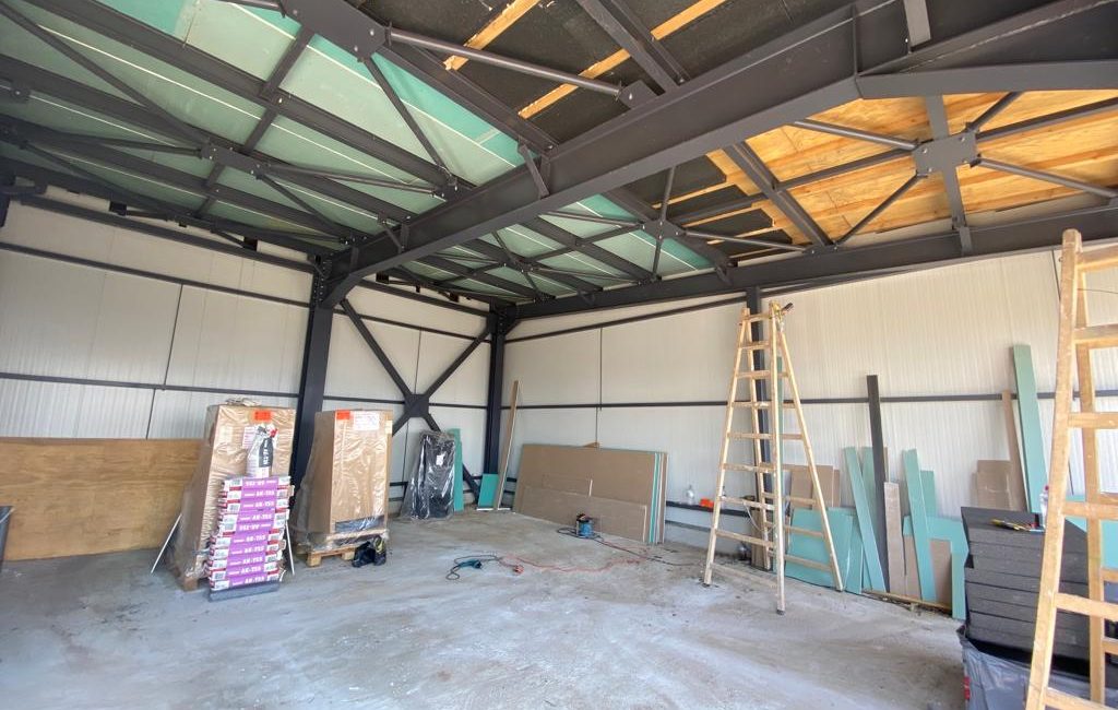 Steel frame with dry wall and wood in the roof